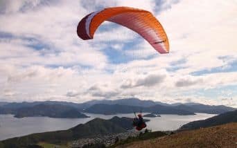 Paraglider taking off above Picton
